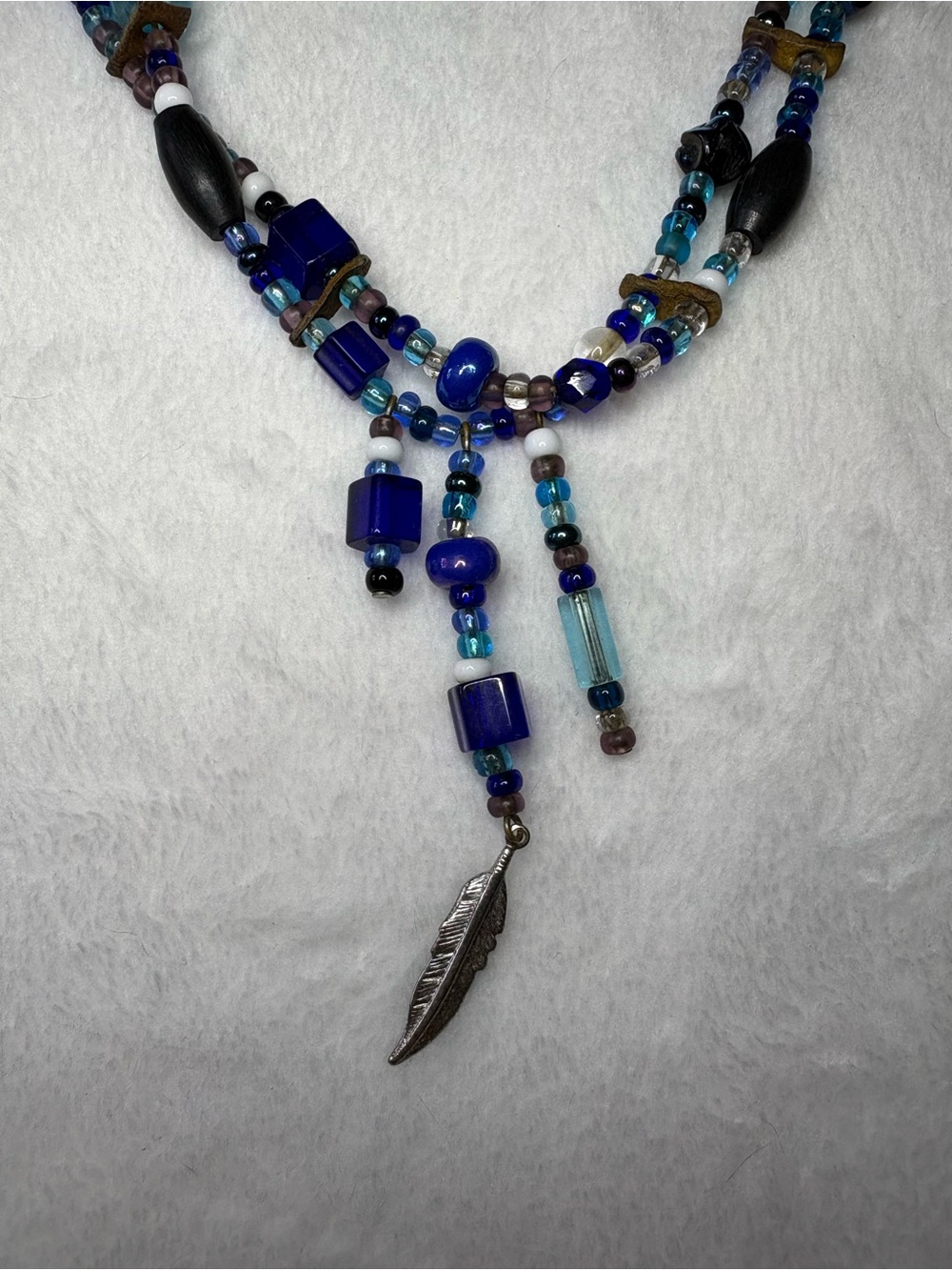 True vintage boho glass bead and feather charm necklace